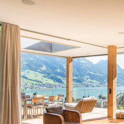 Wood frameless sliding windows with a wooden surface | Patio doors | swissFineLine